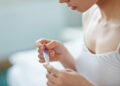 Can a woman still be pregnant if she has a period?